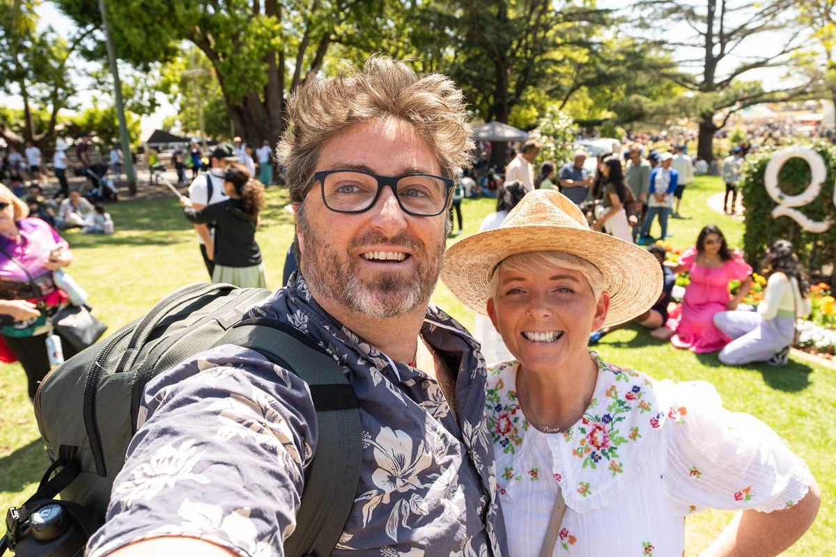 Annie and Steve, the founders of Move Regional, smiling at a busy garden festival