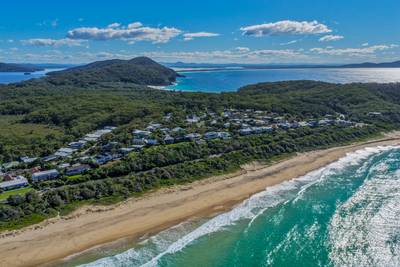Aerial scene capturing Boomerang Beach near Pacific Palms, NSW, Australia