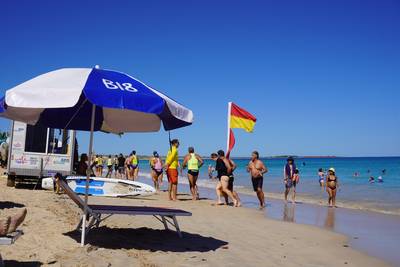 Group of People jogging on a Beach