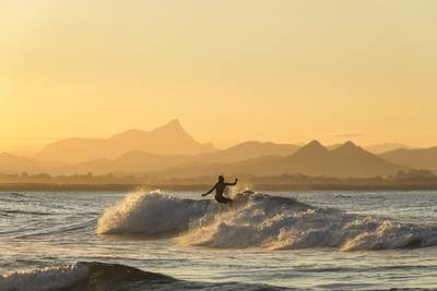 Surfing at sunset