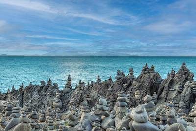 Captain Cook Highway Rock Stacks. Balanced rock stacks line the shoreline in Far North Queensland, Australia. Carefully placed stone…