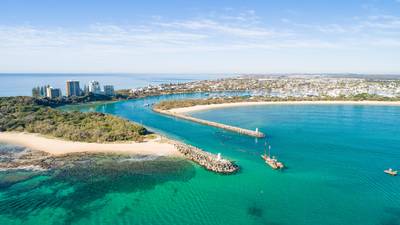 Beautiful aerial sunrise with beach, water, boats, shops and lovely holiday feel at Mooloolaba, Sunshine Coast, close to Brisbane in…