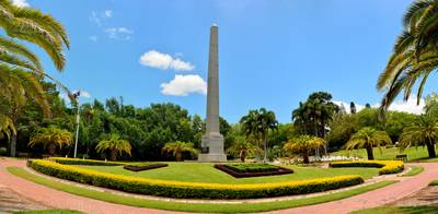 Lawn with memorial column at Botanic Gardens in Rockhampton, QLD,