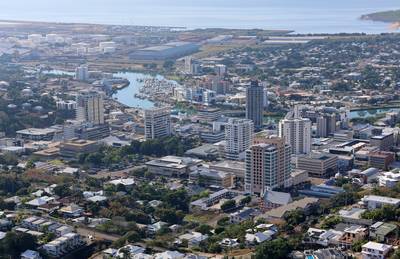 Aerial view of buildings, houses and the Ross River from the Castle Hill lookout in Townsville, Queensland, Australia