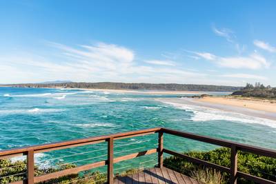 Ocean waves with white foam on a sunny day. Nature tropical paradise background. Tuross Head, NSW, Australia