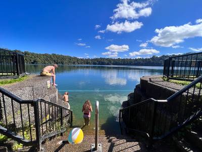 Australian people swim in Lake Eacham Queensland Australia